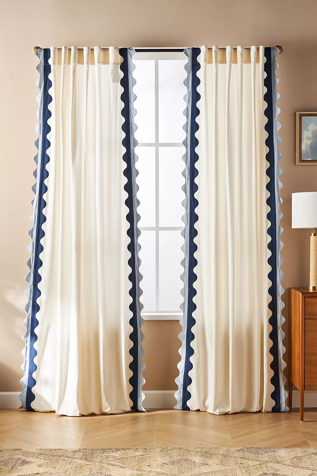 Cream curtains with decorative scallop border trim